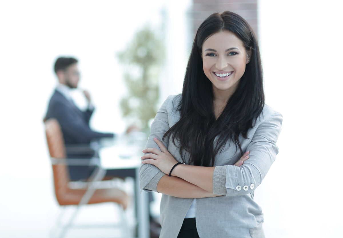 successful young business woman on the office background